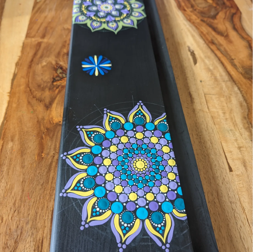 Mandala standing mirror being hand painted during the making process
